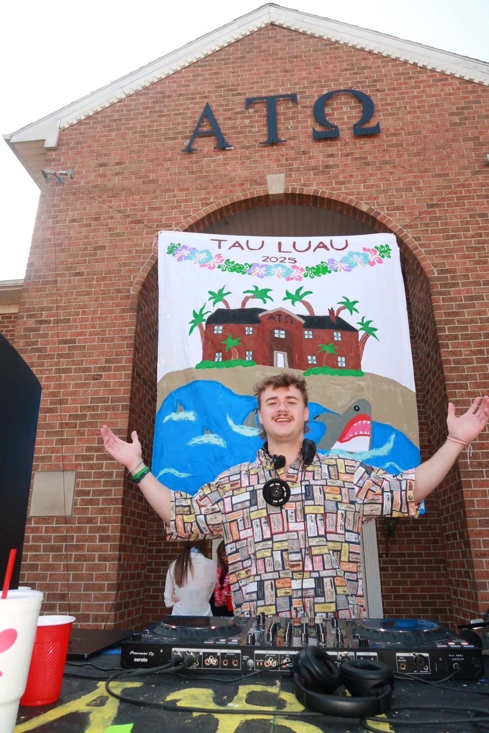 Stoakley DJing at the Alpha Tau Omega house at GVSU